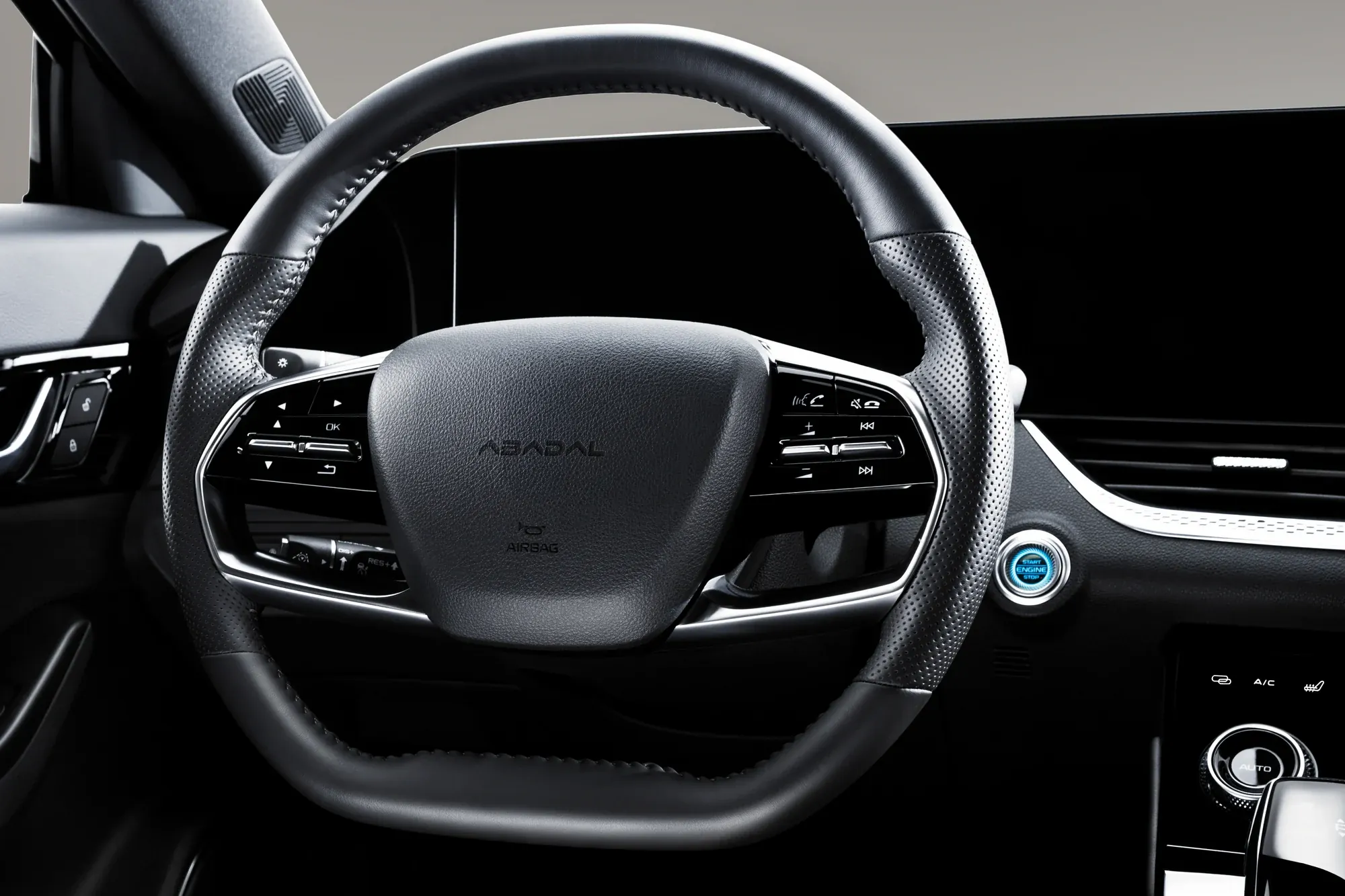 NOVO steering wheel with the ABADAL logo and start button